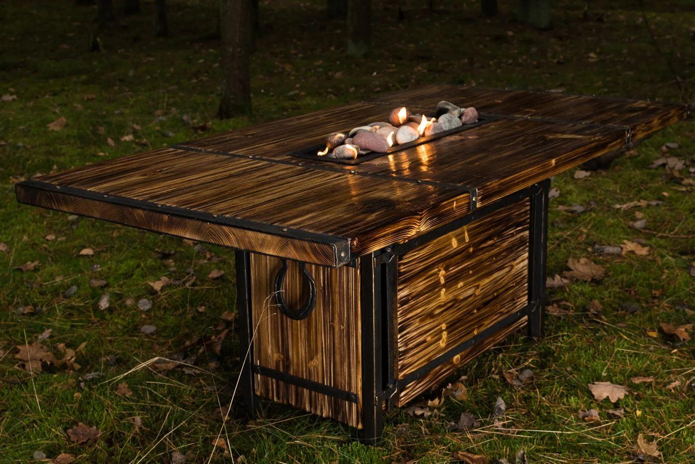 Fire table with a metal frame and charred timber