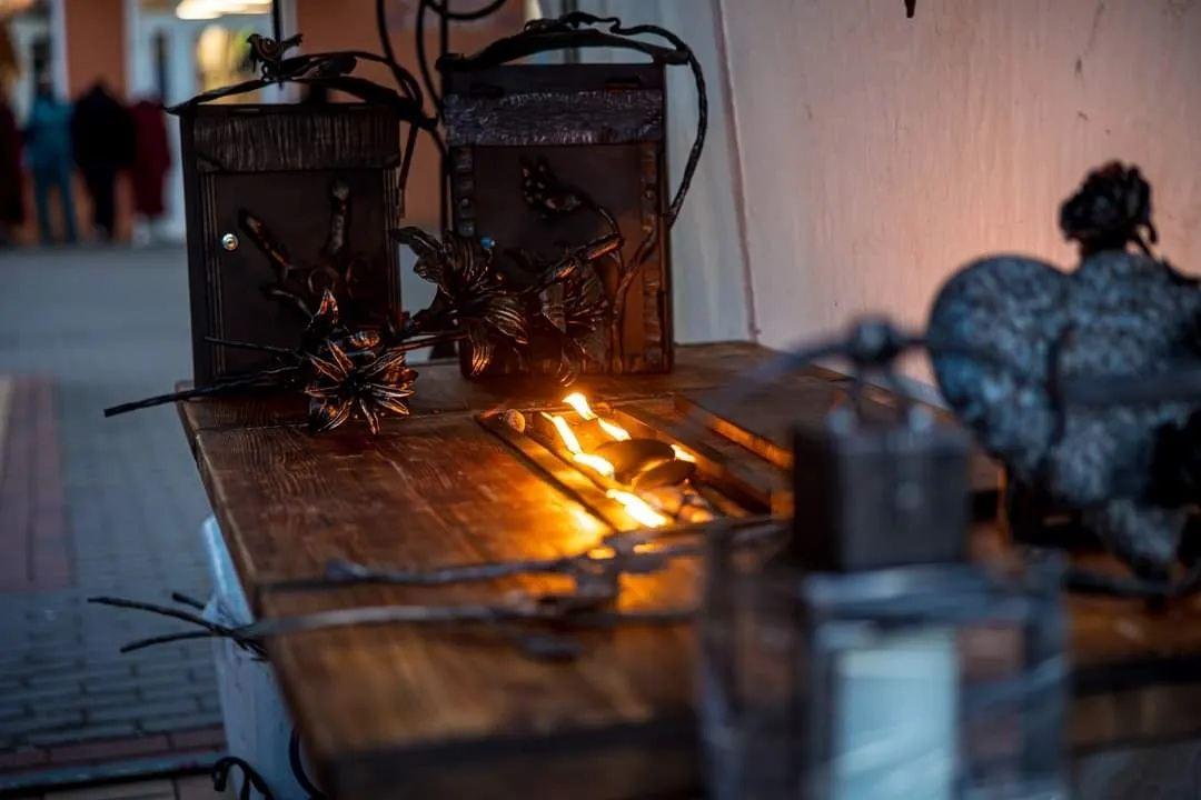 Forged mailboxes on a fire table